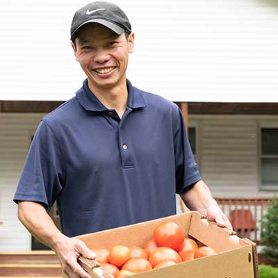 Fr_Nguyen_Carrying_Tomatoes.jpg